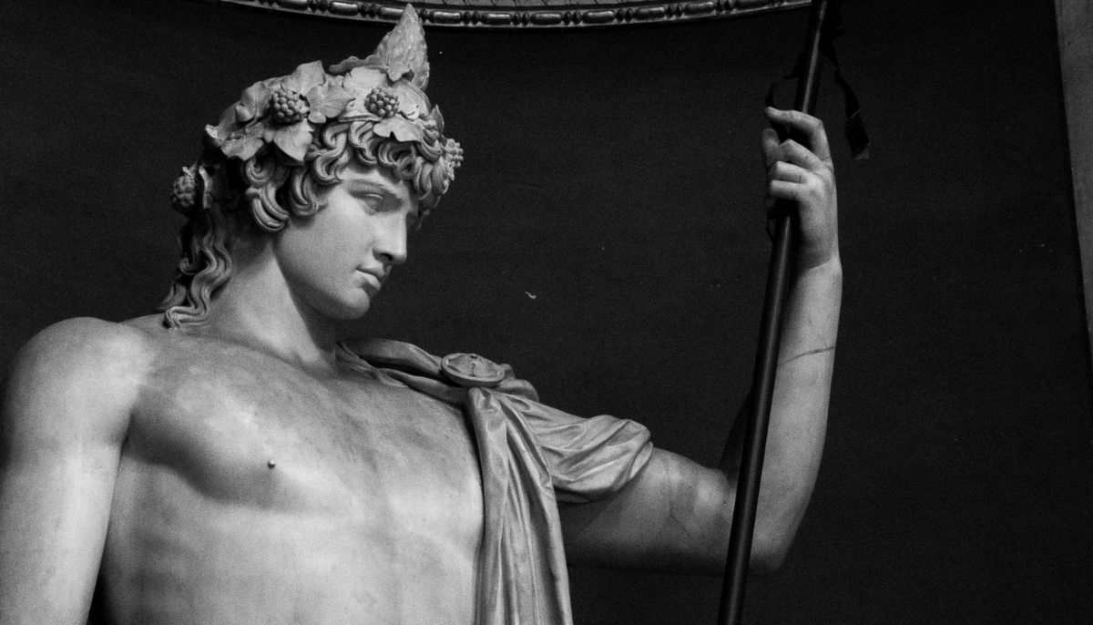 Colossal statue of Antinous as Dionysos-Osiris (ivy crown, head band, cistus and pine cone). Marble, Roman artwork.