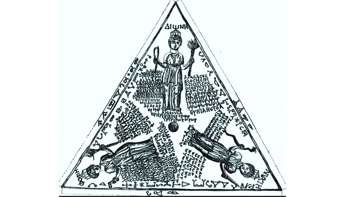 Drawing of a bronze tablet found at Pergamon. It depicts three crowned goddesses labeled as ΔΙΟΝΗ (Dione), ΦΟΙΒΙΗ (Phoibie or Phoebe), and ΝΥΧΙΗ (Nychie), each surrounded by dense inscriptions, mostly untranslatable syllables for incantation (voces magicae). The inscription around Phoebe invokes Persephone, Melinoë, and Leucophryne. The lettering dates the inscription to the first half of the 3rd century AD. Esoteric symbols are inscribed along the edges. The center hole suggests that the tablet was suspended over a surface and used for divination.