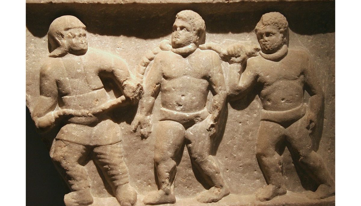 Roman collared slaves. — Marble relief, from Smyrna (Izmir, Turkey), 200 CE.
