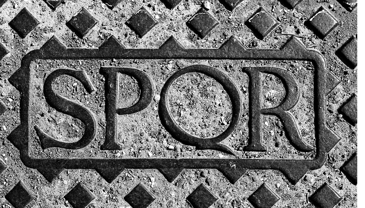 Manhole cover (Detail) in Rome with the letters SPQR (Latin: Senatus PopulusQue Romanus).